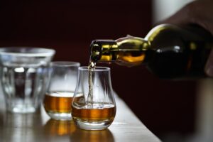 Scotch pour into glasses